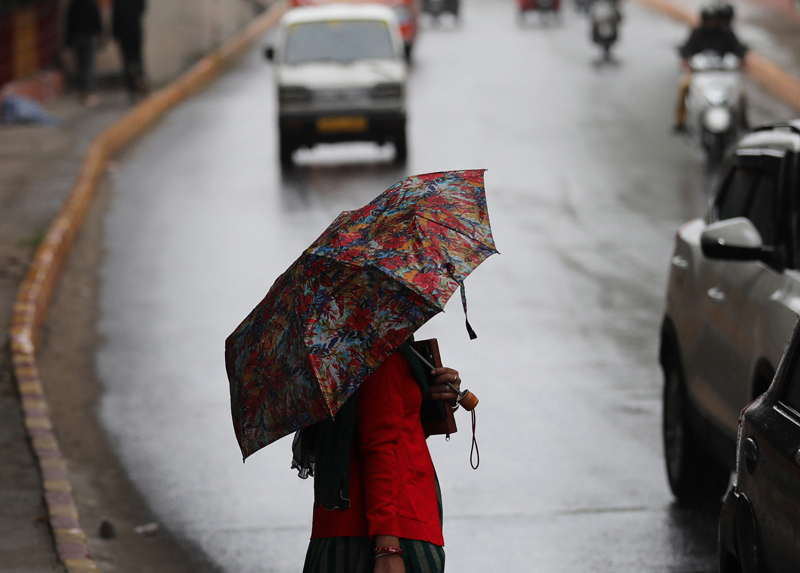 Lash Rake Heavy rains lash Jammu on Monday prompting people to take out umbrellas ...