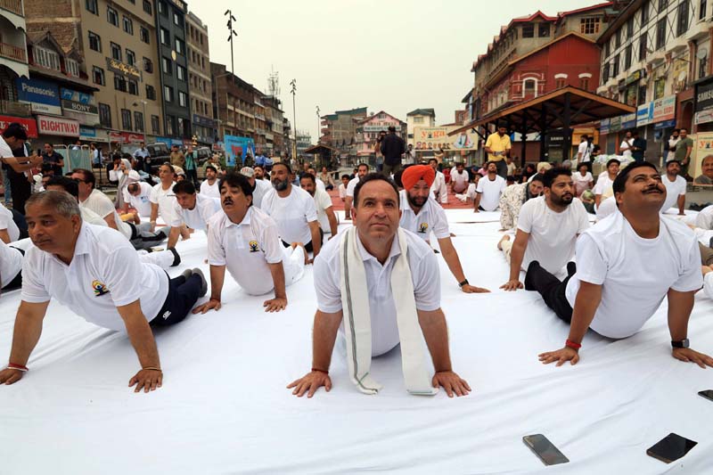 J&K BJP leaders performing yoga at Ghanta Ghar, Lal Chowk.-Excelsior/Shakeel